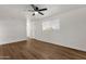 Bright living room featuring hardwood floors and a ceiling fan at 5921 W Hearn Rd, Glendale, AZ 85306