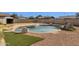 Inviting kidney-shaped pool with surrounding landscaping at 5921 W Hearn Rd, Glendale, AZ 85306