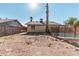 Large backyard with gravel and partial fencing at 604 W Emerald Ave, Mesa, AZ 85210