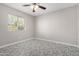 Well-lit bedroom with ceiling fan and patterned flooring at 604 W Emerald Ave, Mesa, AZ 85210