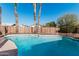 Refreshing blue pool, partially fenced backyard at 604 W Emerald Ave, Mesa, AZ 85210