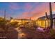 Landscaped backyard with a stone pathway, lighting, and a cactus at 617 S Camino Saguaro --, Apache Junction, AZ 85119