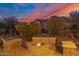 Landscaped backyard with fire pit and stone seating at 617 S Camino Saguaro --, Apache Junction, AZ 85119