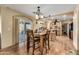 Kitchen with wooden cabinetry, granite countertops, and a dining area at 617 S Camino Saguaro --, Apache Junction, AZ 85119