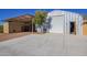 Detached workshop with large garage door and adjacent storage at 617 S Camino Saguaro --, Apache Junction, AZ 85119