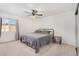 Spacious bedroom with ceiling fan and large closet at 6602 W Desert Cove Ave, Glendale, AZ 85304