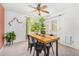 Charming dining area with wood table and access to backyard at 6602 W Desert Cove Ave, Glendale, AZ 85304