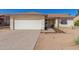 House exterior with a white garage door and walkway at 6602 W Desert Cove Ave, Glendale, AZ 85304