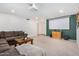 Living room featuring a sectional sofa and a large projection screen at 6602 W Desert Cove Ave, Glendale, AZ 85304