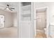 Small bathroom with shower and built-in shelving at 6920 E 4Th St # 103, Scottsdale, AZ 85251