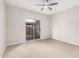 Bright bedroom with carpet flooring and sliding glass door to patio at 6920 E 4Th St # 103, Scottsdale, AZ 85251