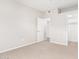 Well-lit bedroom with neutral walls and carpet flooring, offering ample space at 6920 E 4Th St # 103, Scottsdale, AZ 85251