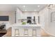 Modern kitchen with white cabinets, quartz countertops, and island at 6920 E 4Th St # 103, Scottsdale, AZ 85251