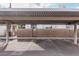 Covered parking area with designated spots and gated access at 6920 E 4Th St # 103, Scottsdale, AZ 85251