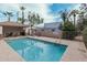 Community swimming pool with a shaded seating area at 6920 E 4Th St # 103, Scottsdale, AZ 85251