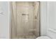 Clean shower with glass enclosure and neutral tile at 6920 E 4Th St # 103, Scottsdale, AZ 85251