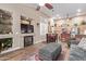 Living room with a fireplace and built-in shelving at 6931 W Blackhawk Dr, Glendale, AZ 85308