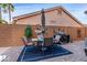 Outdoor patio with dining table and chairs at 6931 W Blackhawk Dr, Glendale, AZ 85308