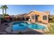 Stunning kidney-shaped pool with patio and landscape at 6931 W Blackhawk Dr, Glendale, AZ 85308