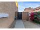 Side yard access with gate and landscaping at 6931 W Blackhawk Dr, Glendale, AZ 85308