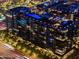 Night aerial view of a modern building with a rooftop pool at 7180 E Kierland Blvd # 1116, Scottsdale, AZ 85254