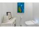 Stylish powder room with modern toilet and art accents at 7180 E Kierland Blvd # 1116, Scottsdale, AZ 85254