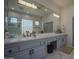 Large bathroom with double vanity, a walk-in shower, and a large mirror at 8136 E Beardsley Rd, Scottsdale, AZ 85255