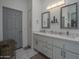 Elegant bathroom with double vanity and marble flooring at 8136 E Beardsley Rd, Scottsdale, AZ 85255