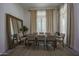 Bright dining room featuring a large table, comfortable chairs, and a statement mirror at 8136 E Beardsley Rd, Scottsdale, AZ 85255