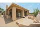 Back exterior view of house with covered patio and firepit at 8136 E Beardsley Rd, Scottsdale, AZ 85255