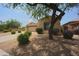 Single-story home with attached garage and desert landscaping at 8136 E Beardsley Rd, Scottsdale, AZ 85255