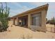 Back exterior view of house with covered patio at 8136 E Beardsley Rd, Scottsdale, AZ 85255