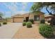 Front view of single-story home with desert landscaping at 8136 E Beardsley Rd, Scottsdale, AZ 85255