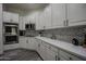 Modern kitchen with white cabinets, quartz countertops, and stainless steel appliances at 8136 E Beardsley Rd, Scottsdale, AZ 85255