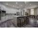 Modern kitchen with white cabinets, quartz countertops, and an island at 8136 E Beardsley Rd, Scottsdale, AZ 85255