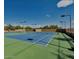 Community tennis court with blue surface and green perimeter at 8136 E Beardsley Rd, Scottsdale, AZ 85255