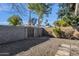 Backyard with gravel, stone path, and block wall at 829 E 9Th Pl, Mesa, AZ 85203