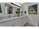 Bathroom with dual vanity, quartz countertop, and large mirror at 829 E 9Th Pl, Mesa, AZ 85203