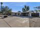 Ranch style home with carport and mature landscaping at 829 E 9Th Pl, Mesa, AZ 85203