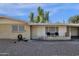 Front view of a ranch-style house with small patio and landscaping at 829 E 9Th Pl, Mesa, AZ 85203