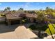 Single story home with tile roof, large driveway and landscaping at 8429 W Sands Ct, Peoria, AZ 85383