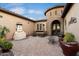 Stone and tile courtyard with a fountain and seating area at 8429 W Sands Ct, Peoria, AZ 85383