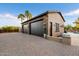 Large two-car garage featuring extra storage and beautiful landscaping at 8429 W Sands Ct, Peoria, AZ 85383