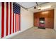 Garage with extensive storage cabinets and American flag at 8429 W Sands Ct, Peoria, AZ 85383