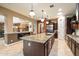 Granite island kitchen with stainless steel appliances at 8429 W Sands Ct, Peoria, AZ 85383