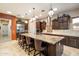 Gourmet kitchen boasts granite island and stainless steel appliances at 8429 W Sands Ct, Peoria, AZ 85383