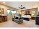 Main bedroom with king bed and sitting area at 8429 W Sands Ct, Peoria, AZ 85383