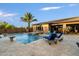 Resort-style backyard with a large pool, spa, and comfortable lounge chairs at 8429 W Sands Ct, Peoria, AZ 85383