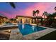 Stunning pool and spa area at sunset with a covered patio at 8429 W Sands Ct, Peoria, AZ 85383