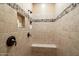 Large walk-in shower with tiled walls and built-in seat at 8429 W Sands Ct, Peoria, AZ 85383